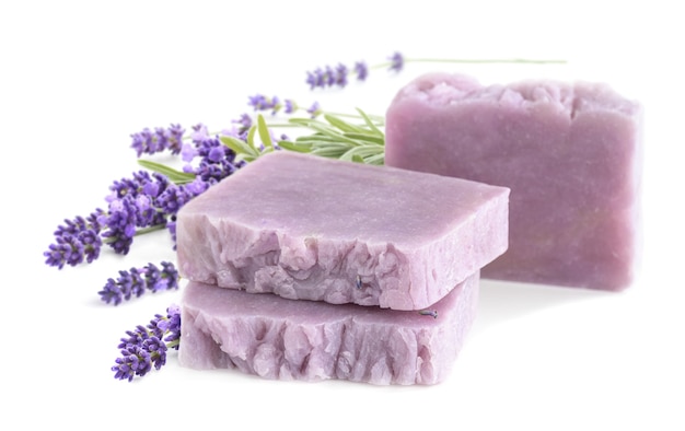 Homemade lavender soap bars with lavender flowers bunch isolated on a white background