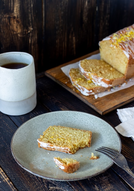 Homemade lemon cake on a wooden table. Recipe. Pastries.