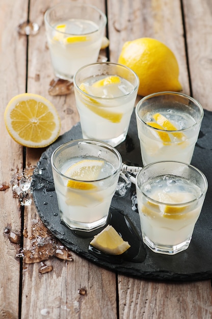 Homemade lemonade with lemon and ice