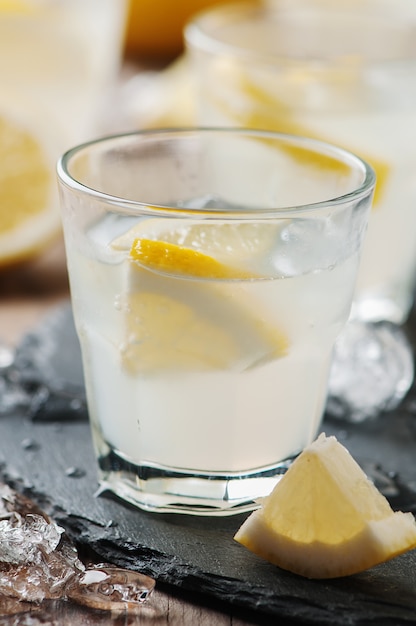 Homemade lemonade with lemon and ice