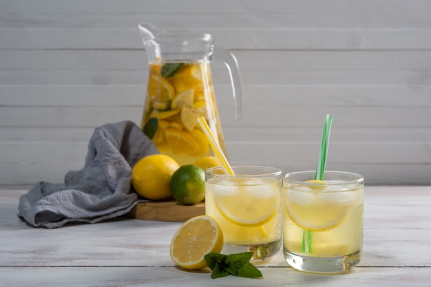 Homemade lemonade with mint from lemone and orange, citrus refreshig beverage in glass