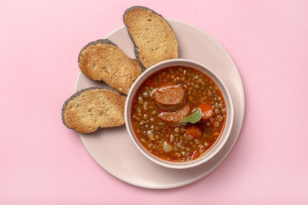 Homemade lentil stew with vegetables and chorizo