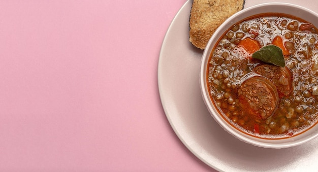 Homemade lentil stew with vegetables and chorizo