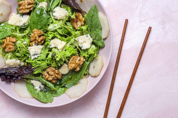 Homemade lettuce assortment salad with blue cheese, walnuts and pear