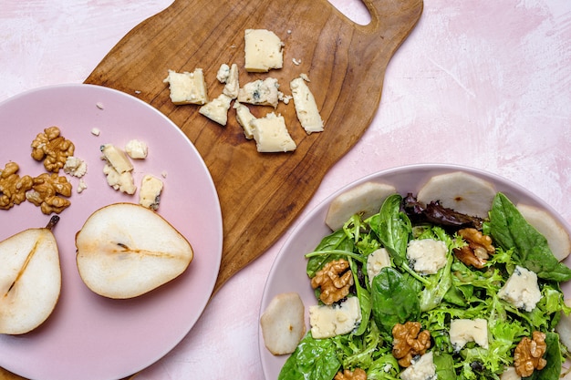 Homemade lettuce assortment salad with blue cheese, walnuts and pear