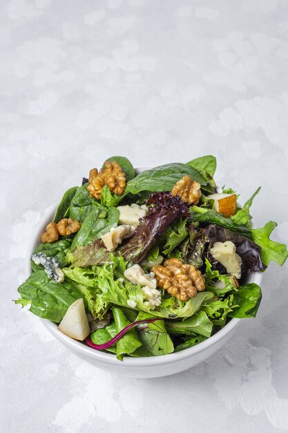 Homemade lettuce assortment salad with blue cheese, walnuts and pear