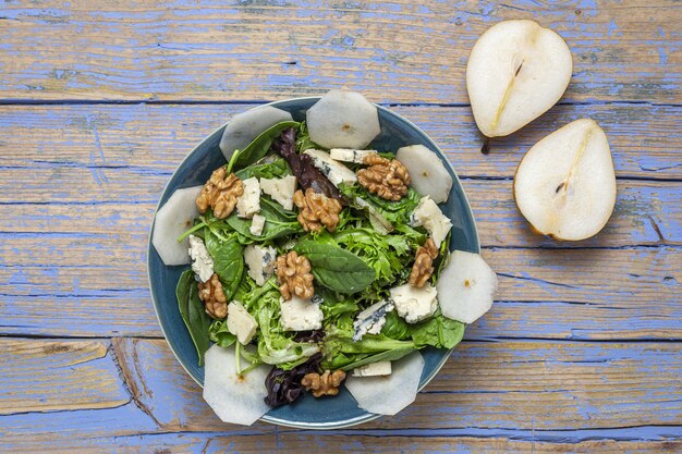 Homemade lettuce assortment salad with blue cheese, walnuts and pear