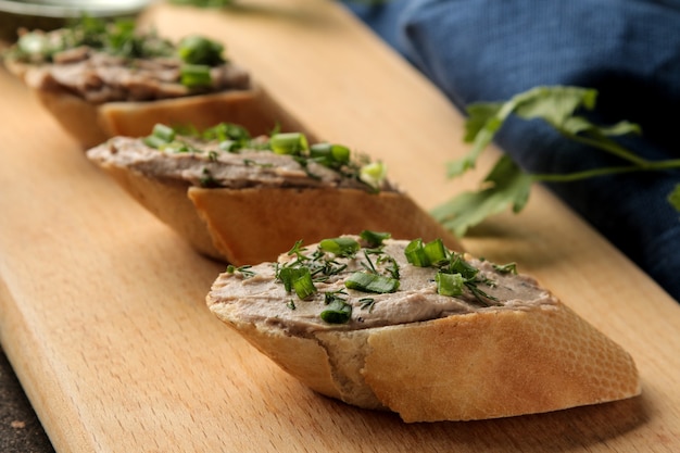 Homemade liver pate with greens on bread