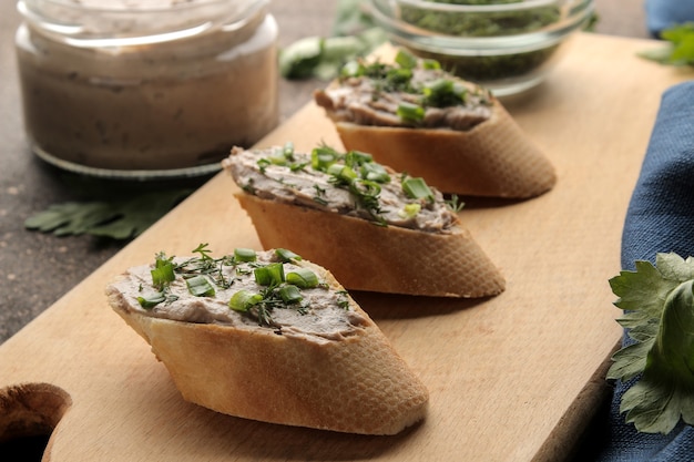 Homemade liver pate with greens on bread