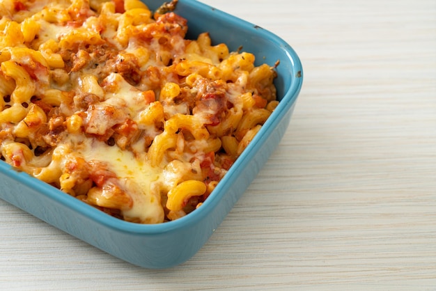 Homemade macaroni bolognese with cheese