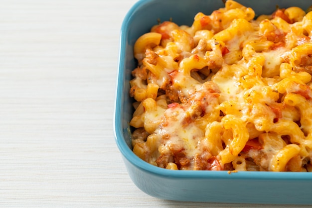 Homemade macaroni bolognese with cheese