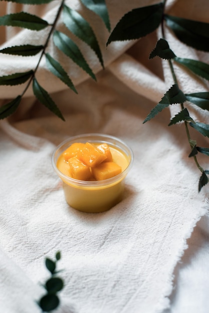 Homemade mango pudding in plastic cup for take away