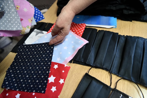 Homemade Manufacturing Of Protective Trendy Medical Face Mask. Tailor Woman Sewing With Machine At Home, Healthcare New Normal Concept In Coronavirus Covid19 Lockdown