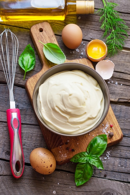 Homemade mayonnaise sauce and ingredients. 