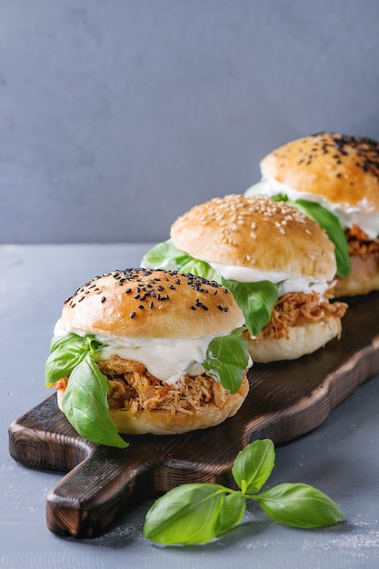 Homemade mini burgers with pulled chicken