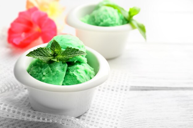 Homemade mint icecream on light wooden background