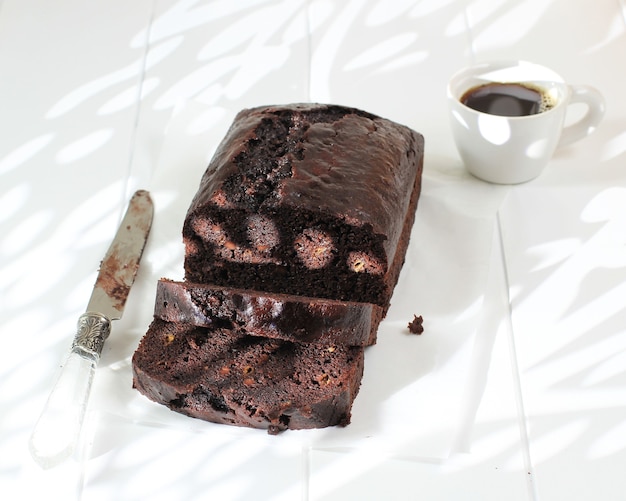 Homemade Moist Loaf Chocolate Banana Cake Brownies, Copy Space on White Table