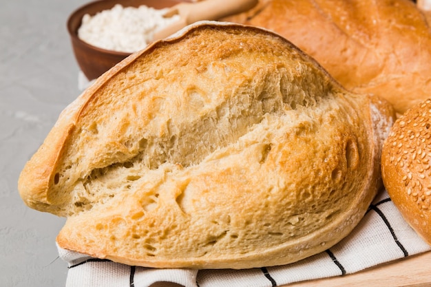 Homemade natural breads Different kinds of fresh bread as background perspective view with copy space