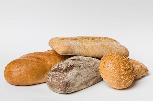 Homemade natural breads Different kinds of fresh bread as background perspective view with copy space