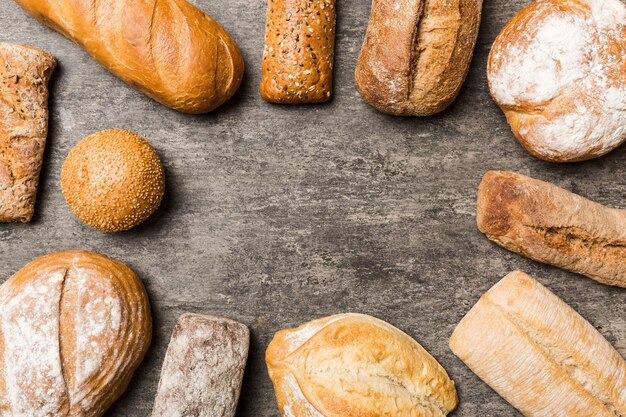 Homemade natural breads different kinds of fresh bread as background top view with copy space