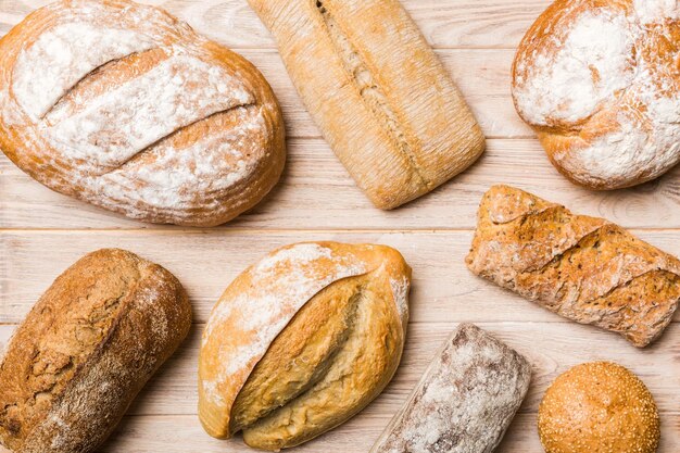 Homemade natural breads different kinds of fresh bread as background top view with copy space