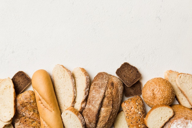 Homemade natural breads Different kinds of fresh bread as background top view with copy space