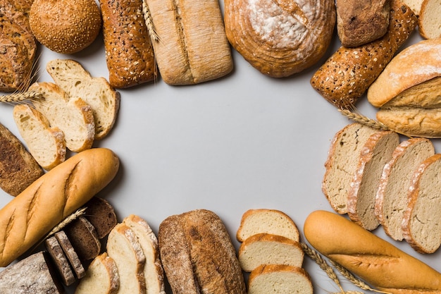 Homemade natural breads Different kinds of fresh bread as background top view with copy space