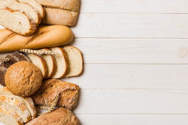 Homemade natural breads Different kinds of fresh bread as background top view with copy space