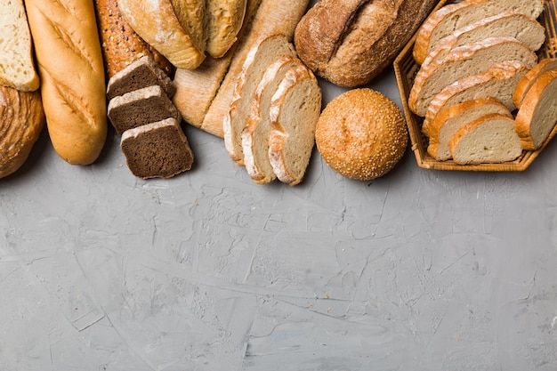 Homemade natural breads Different kinds of fresh bread as background top view with copy space