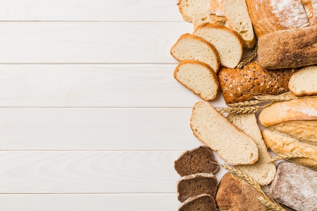 Homemade natural breads Different kinds of fresh bread as background top view with copy space