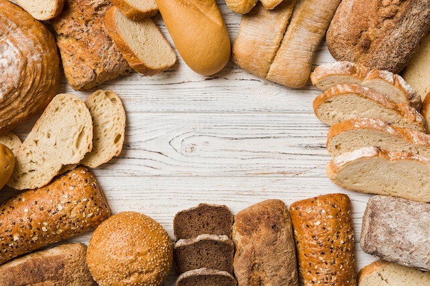 Homemade natural breads Different kinds of fresh bread as background top view with copy space