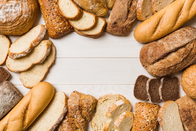 Homemade natural breads Different kinds of fresh bread as background top view with copy space