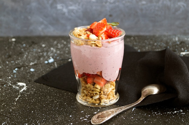 Homemade natural yogurt with strawberries and muesli.