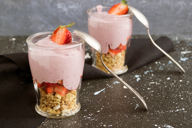 Homemade natural yogurt with strawberries and muesli.