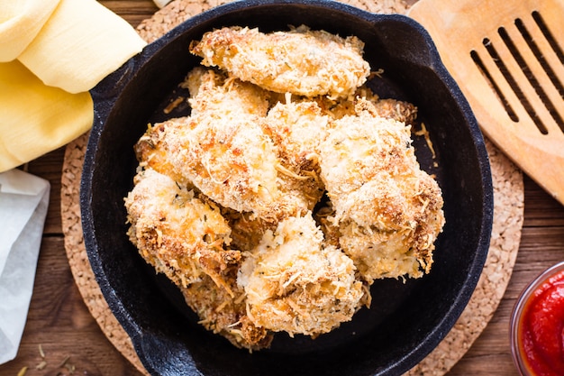 Homemade nuggets from chicken in a frying pan