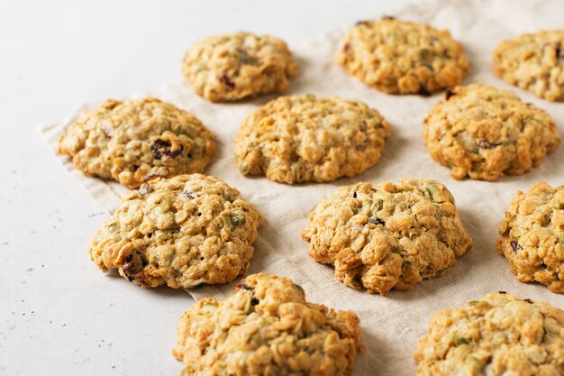 Homemade oat cookies on white background, healthy snack, copy space