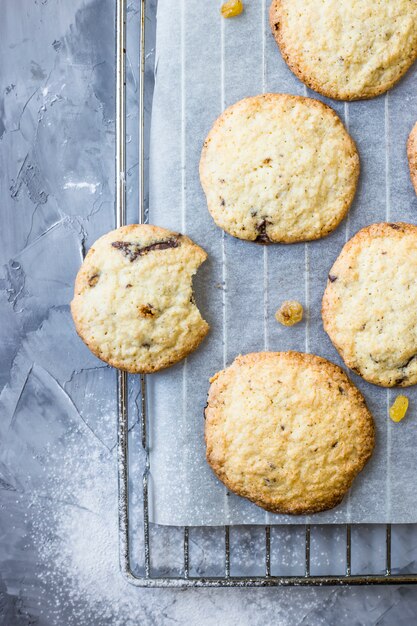 Homemade oatmeal cookies with chocolate chips on a gray kitchen table 