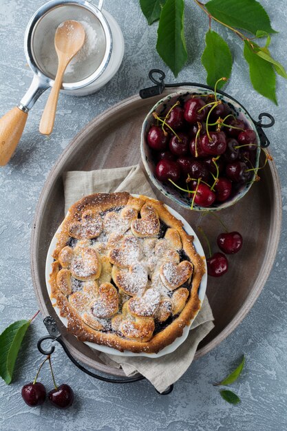 Homemade open cherry pie with lattice