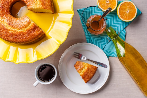 Homemade orange cake and cup of coffee