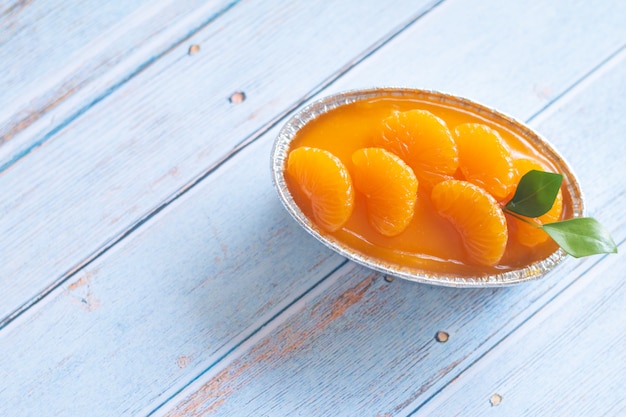 Homemade orange cake on wooden vintage table  