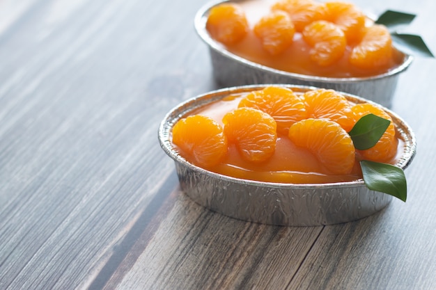 Homemade orange cake on wooden vintage table 