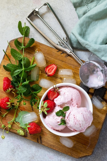 Homemade Organic Strawberry Ice Cream Strawberry ice cream balls with mint leafon