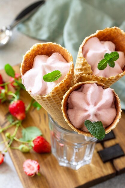 Homemade Organic Strawberry Ice Cream Strawberry of ice cream in waffle cones