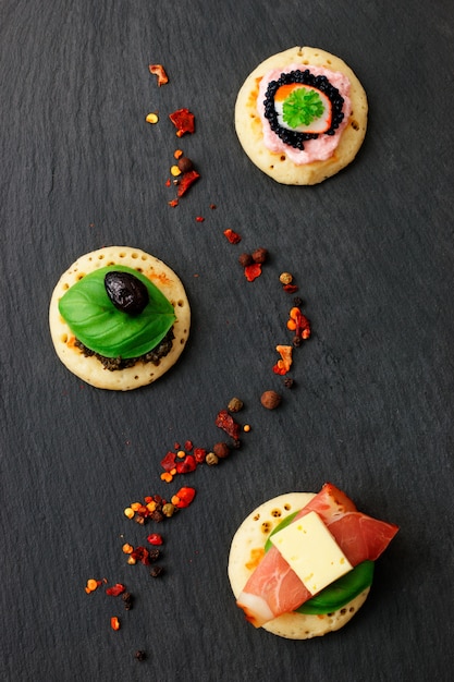 Homemade pancake canapes on slate stone plate for finger food party