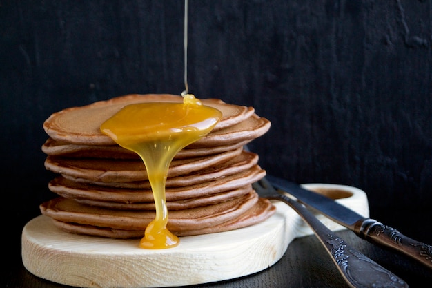 Homemade pancakes with honey.