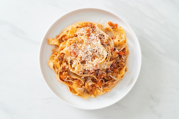 Homemade pasta fettuccine bolognese with cheese - Italian food style