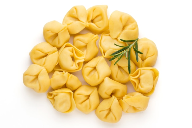 Homemade pasta,  raw tortellini with herbs.