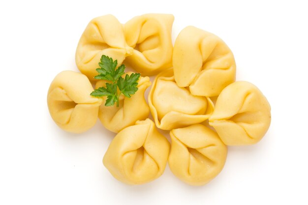 Homemade pasta, raw tortellini with herbs