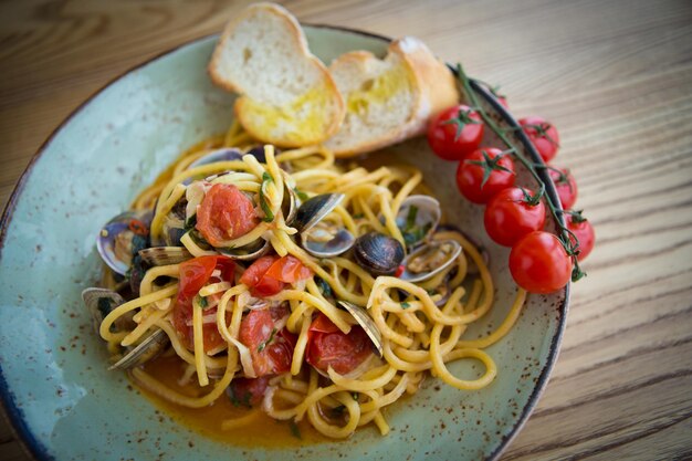 Homemade pasta with seafood and cherry tomatoes