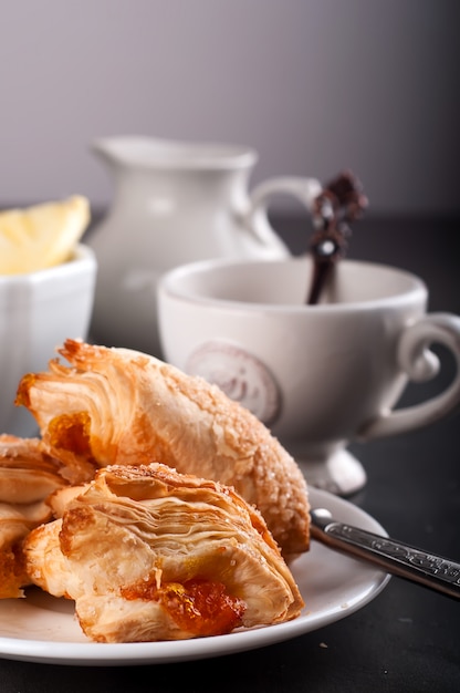 Homemade pastry with orange and Mugs of  Green Tea 